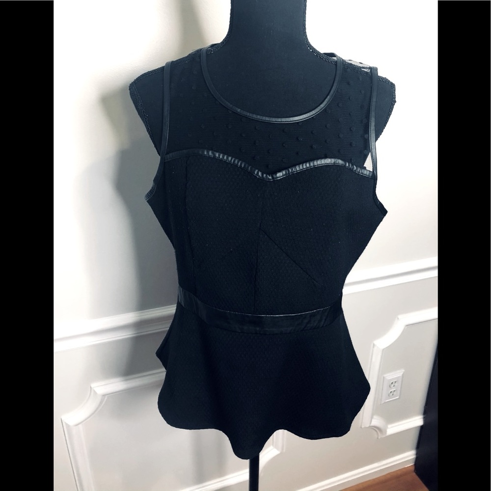 Peplum top with with faux leather trim